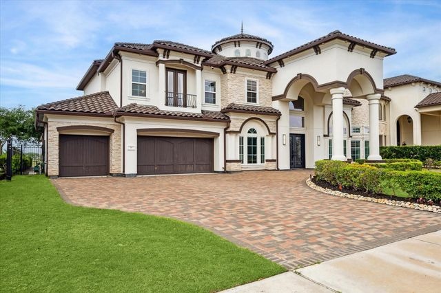 Beautiful Mediterranean front exterior of a Sugar Land home, ideal for listings by expert house selling agents Sugar Land.