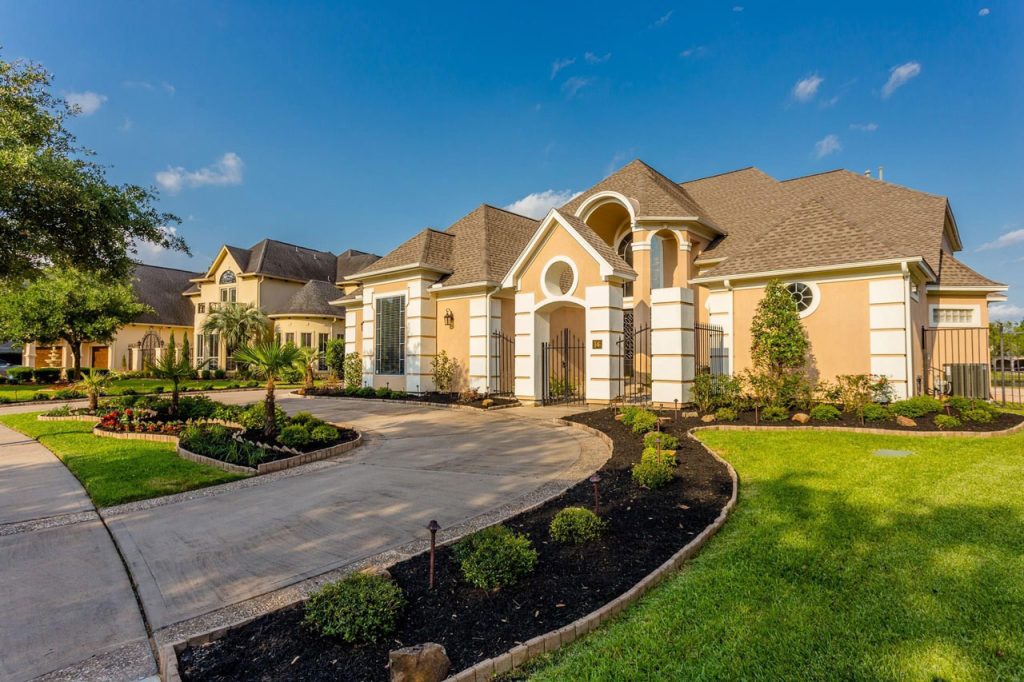 Sugar Land Mediterranean house featuring impeccable curb appeal and for sale by top house selling agents Sugar Land.