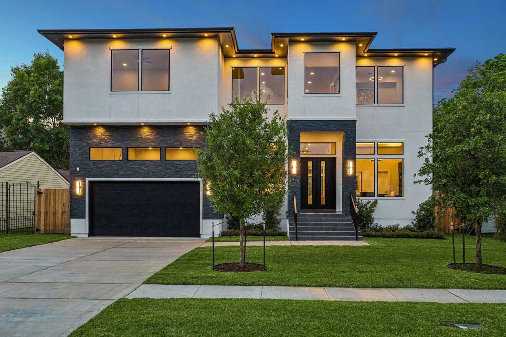 A stunning modern home exterior shown at dusk, listed by expert home selling agents sugar land for a quick and profitable sale.
