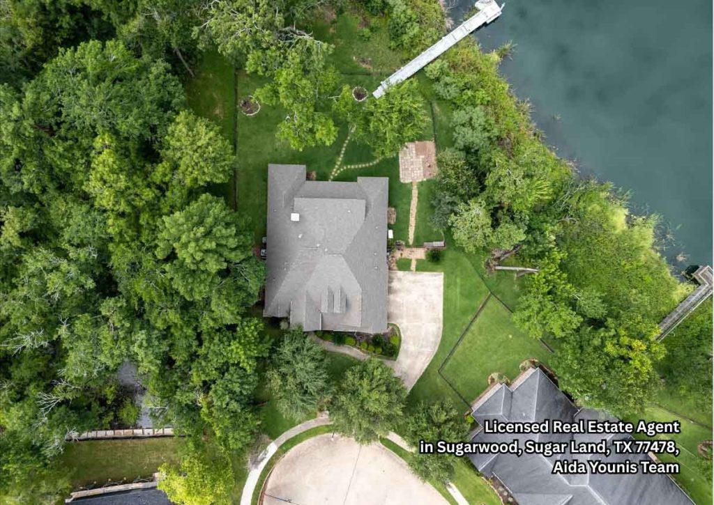 Aerial lakefront property with private dock promoted by home selling agents Sugar Land for luxury home listings.