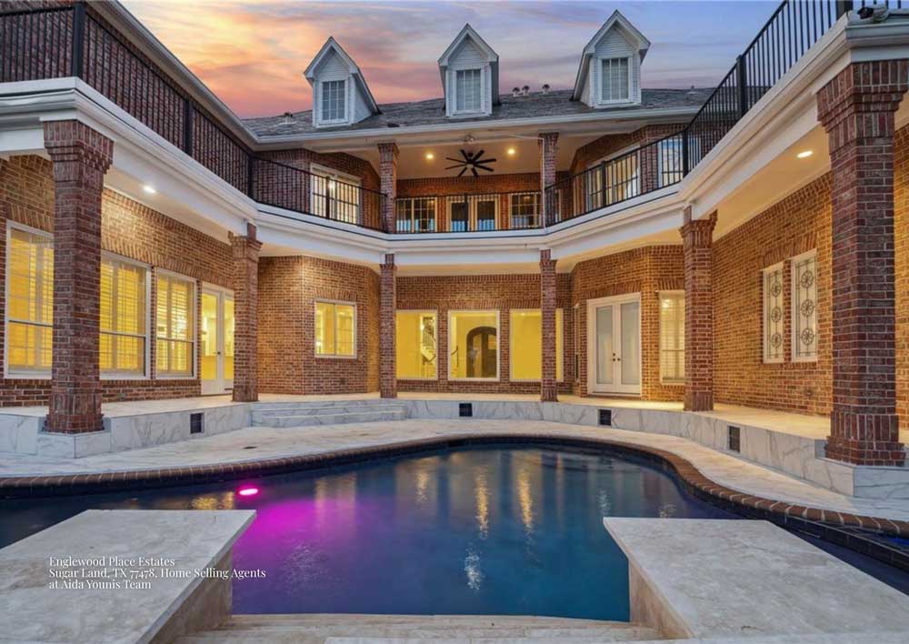 Luxury pool and brick patio presented by home selling agents Sugar Land at Englewood Place Estates in TX 77478.