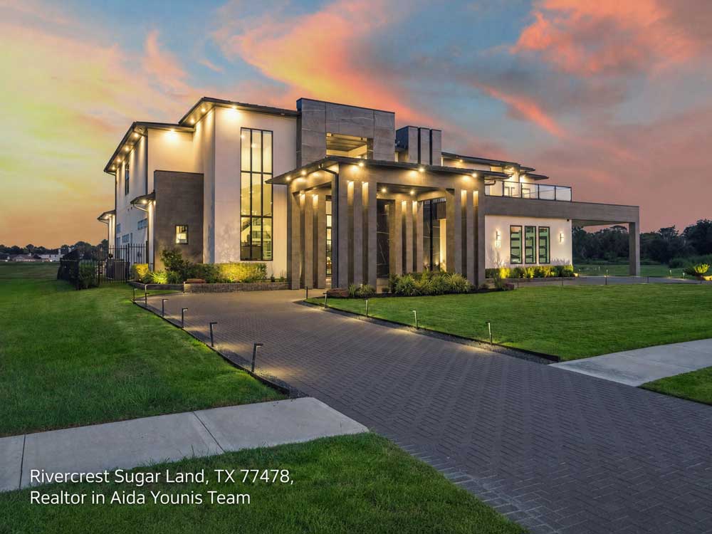 Modern luxury home in Rivercrest listed by a realtor Sugar Land buyers trust, featuring a paved driveway at sunset.