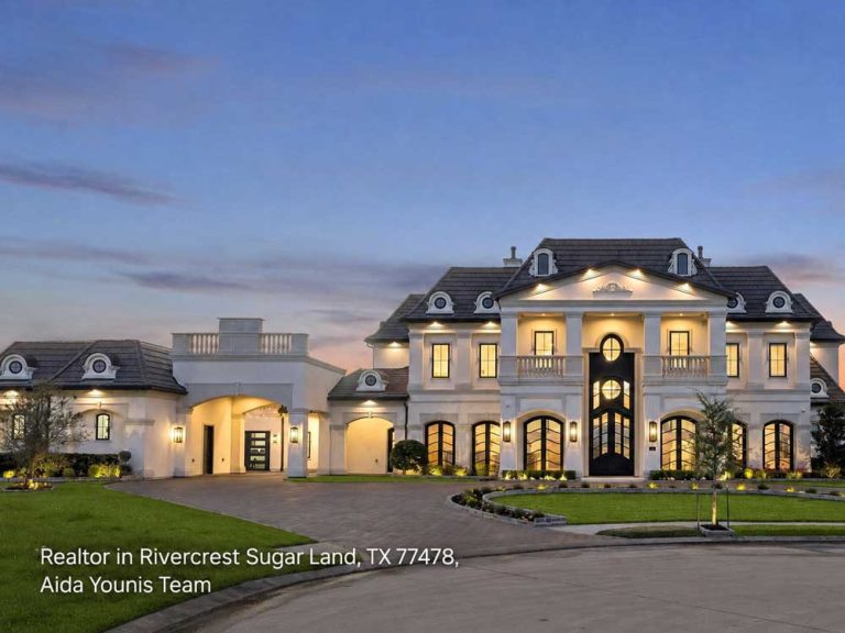 An elegant, classic Rivercrest mansion listed by an expert realtor Sugar Land team, showcasing beautiful twilight lighting.