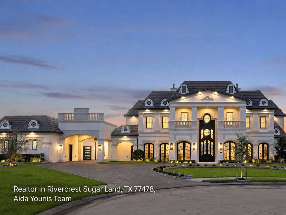 An elegant, classic Rivercrest mansion listed by an expert realtor Sugar Land team, showcasing beautiful twilight lighting.