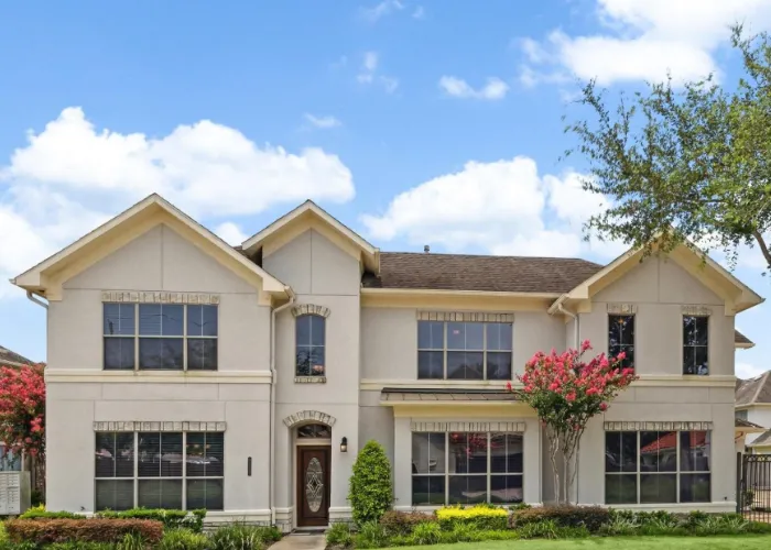 Elegant two-story house with front landscaping and trees at 4319 Stonebrook Lane, Missouri City, TX 77459.