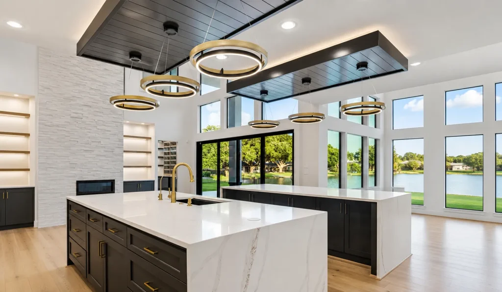 Modern luxury kitchen with double marble islands and ring chandeliers featured in an Aida Younis Team Open House tour.