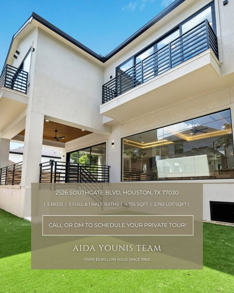 Modern backyard with green lawn and balconies for a luxury new construction home Rice Museum District Houston listing.